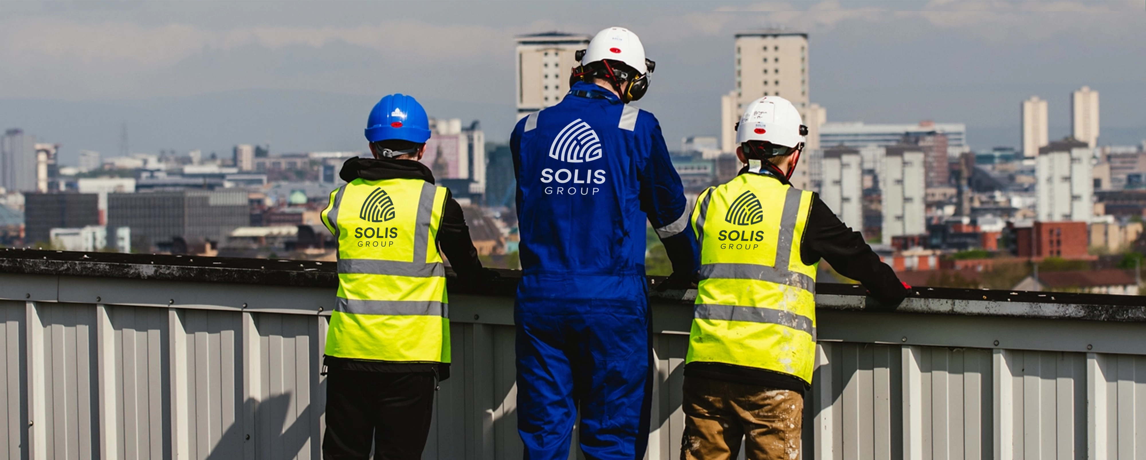 SOLIS engineers overlooking the Glasgow skyline